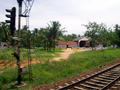 farms and buildings along the railroad