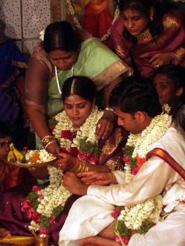 A string is tied around the brides wrist