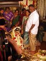 Bride washing her parents feet