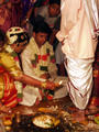 Bride and groom wash his parents feet 